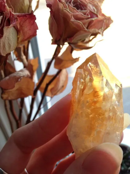 A well-worn citrine ring showing surface micro-scratches