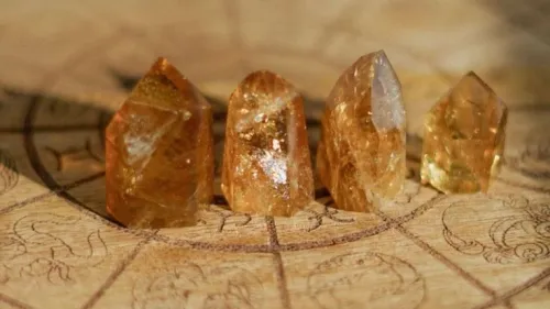 Comparison photo illustrating potential citrine fading: one stone shaded, one exposed to intense light